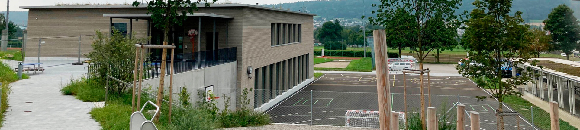 Schulhausumbau und Neubau eines Doppelkindergartens mit Sporthalle Featured Image