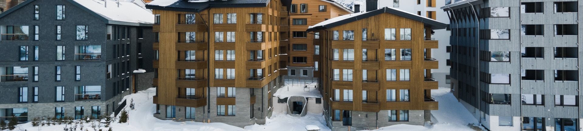 Neubau der Appartementhäuser TurmfalkeSuites in Andermatt Featured Image